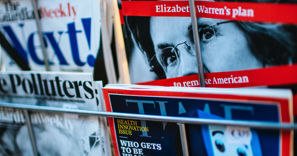 News Magazines and Papers on a shelf.